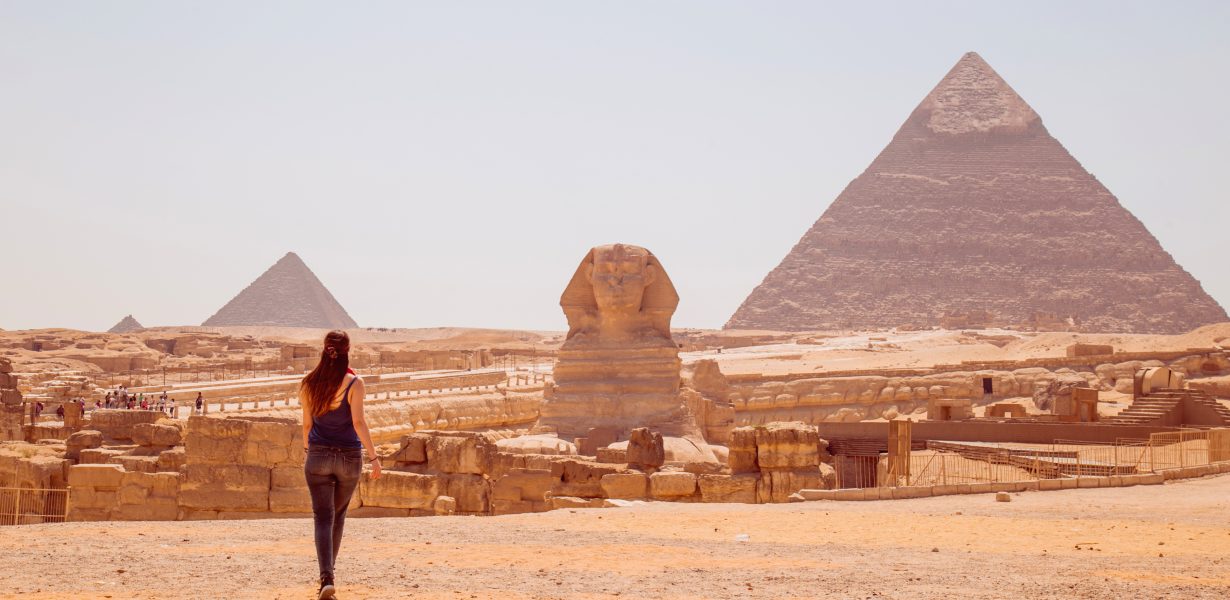 Woman with Sphinx and Great Pyramid of Giza
